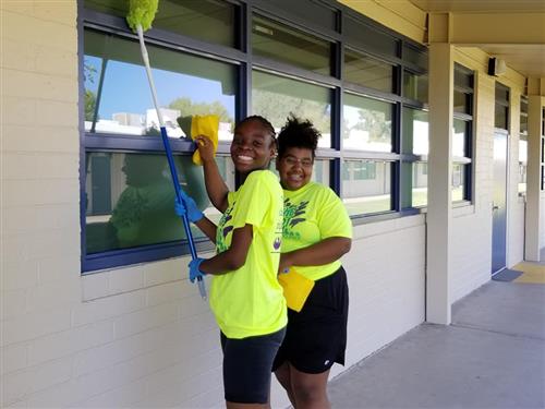 students clean up campus